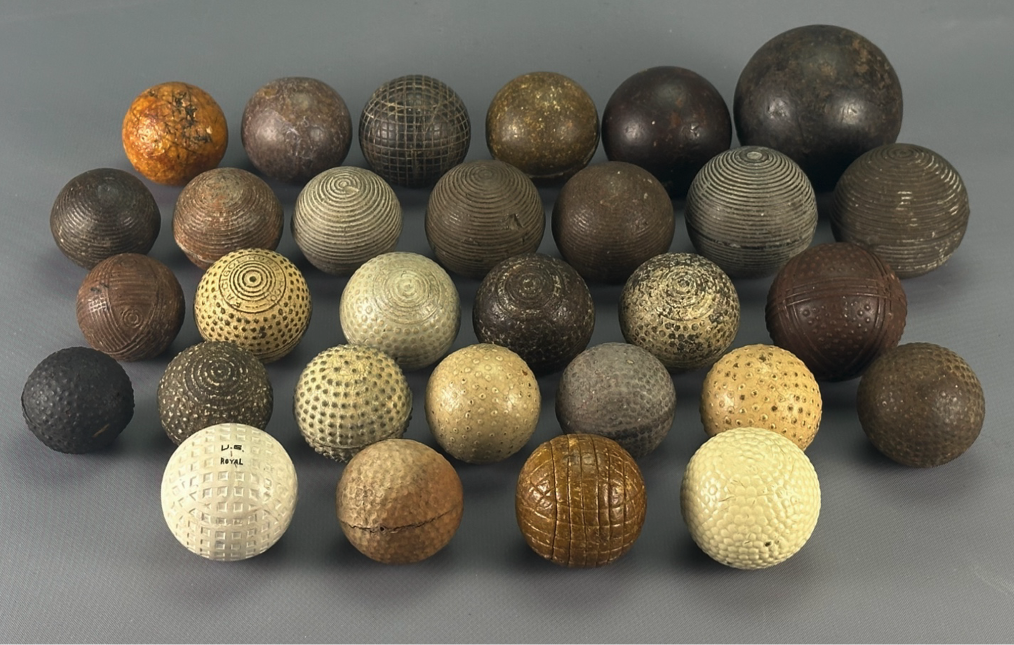 U.S. Royal golf ball, metal dimpled ball, mesh ball, and Chemico Bob golf ball