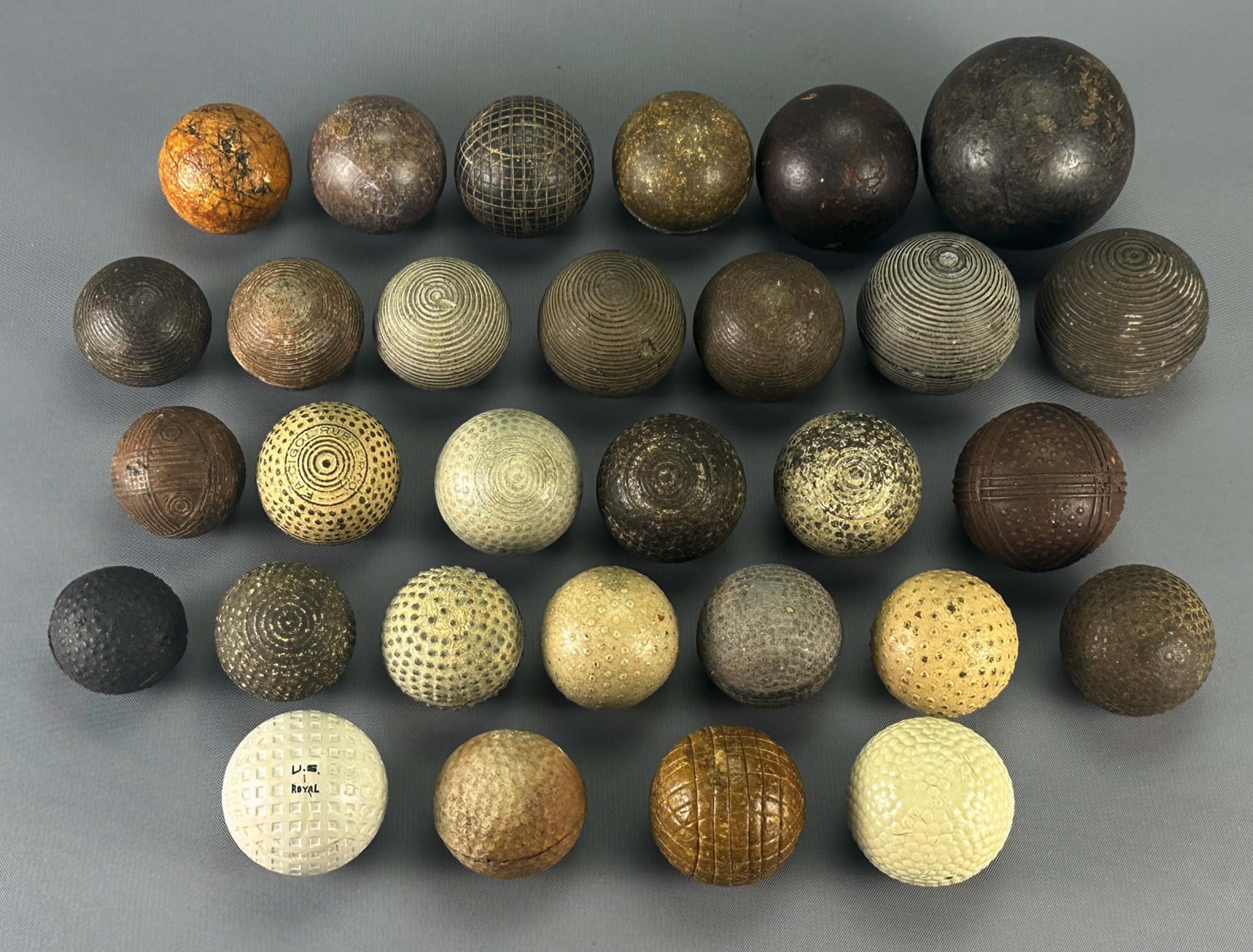 Collection showing genuine golf balls versus play balls and other balls