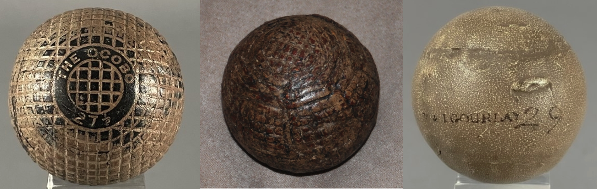 Three antique golf balls showing varying degrees of paint discoloration